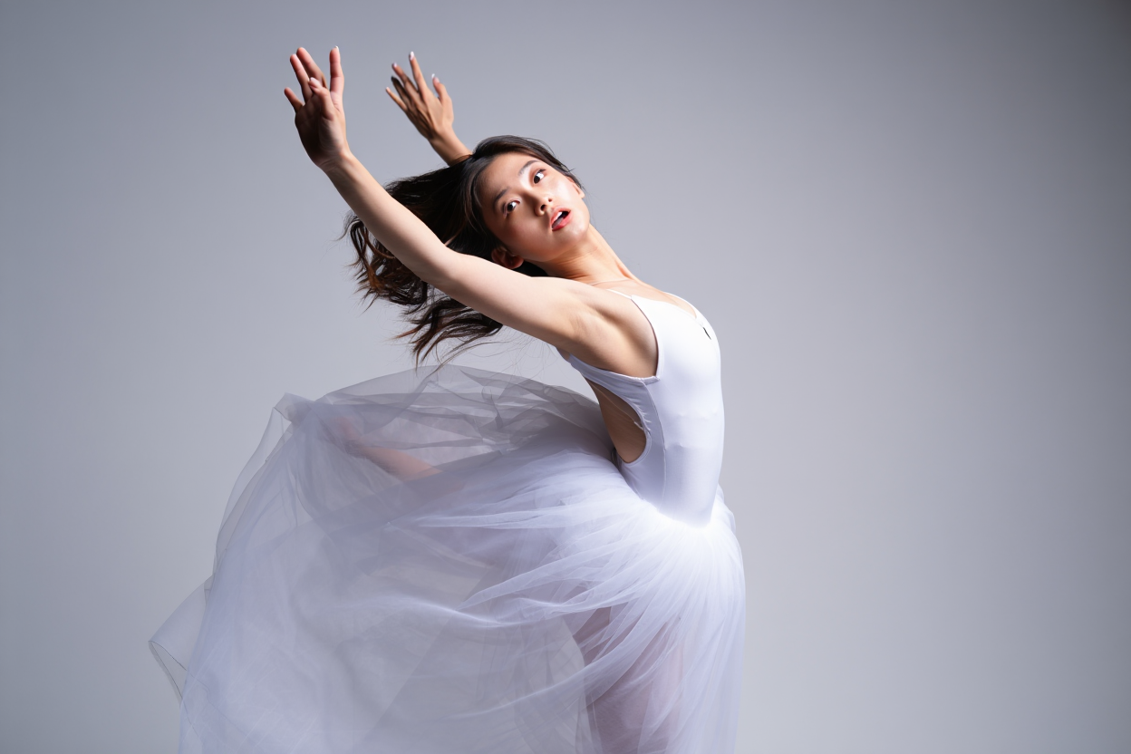 Elegant Ballerina in Motion: A Graceful Dance Captured with Fluid Movements and Soft Tulle Fabric Against a Minimalist Background