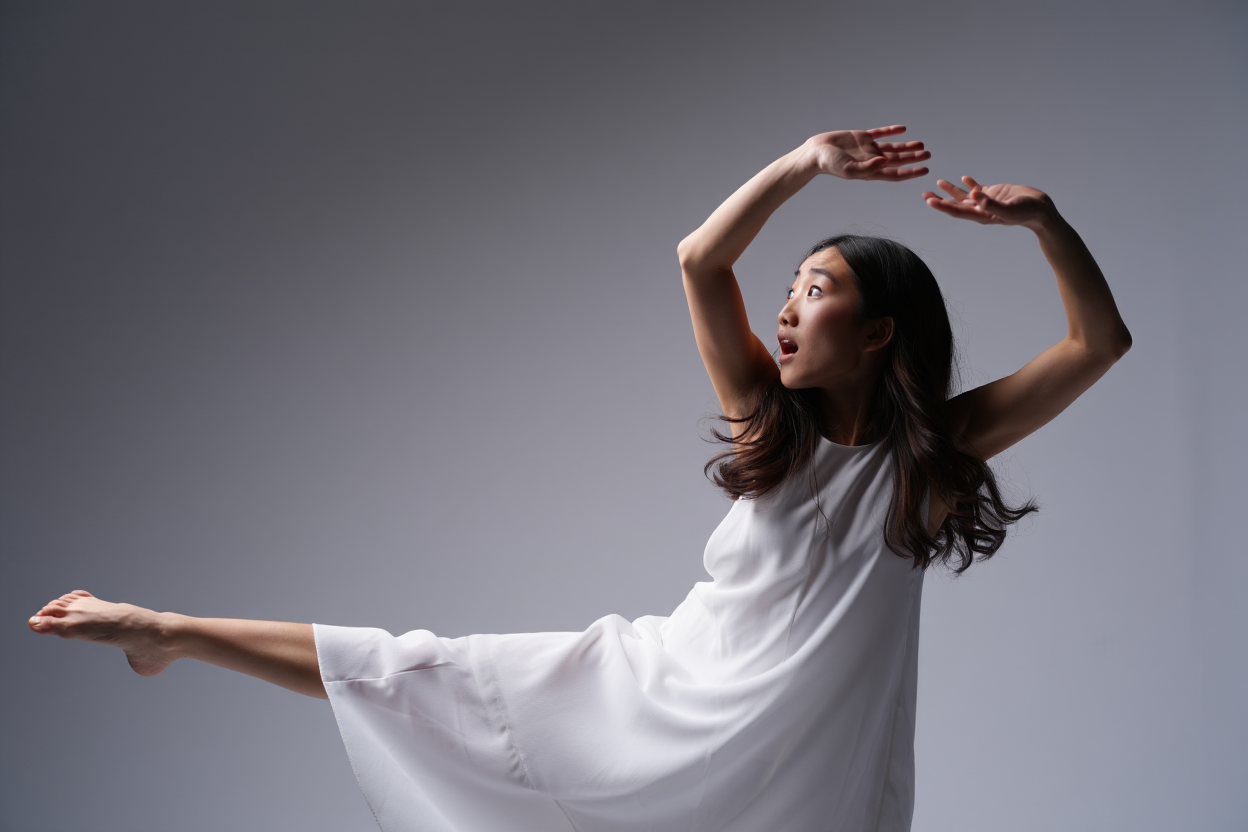 Dynamic Dance Pose of a Woman in White Dress Capturing Fluidity and Emotion in Movement