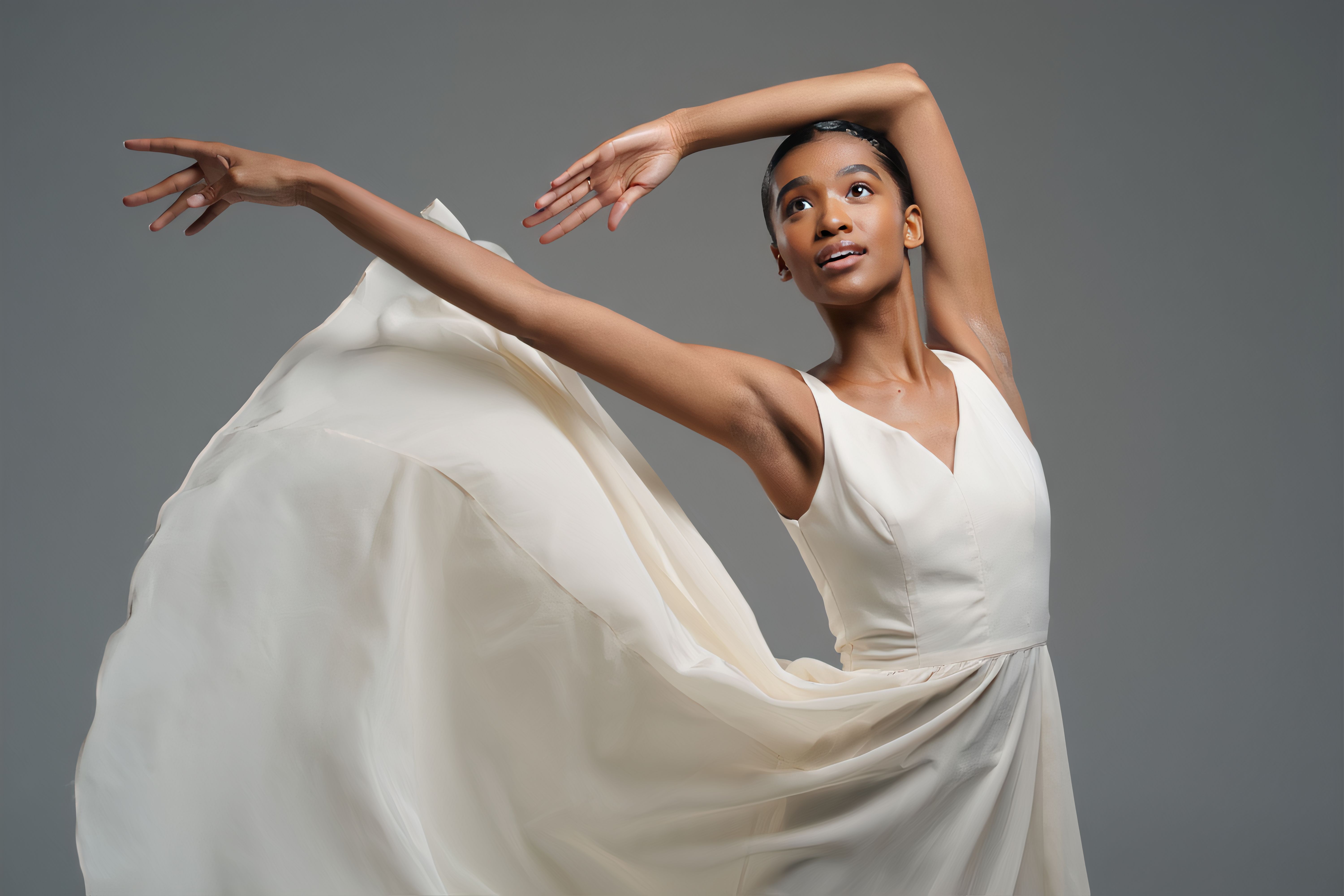 Graceful Dancer Captivates the Audience with Fluid Movements and Elegant Dress